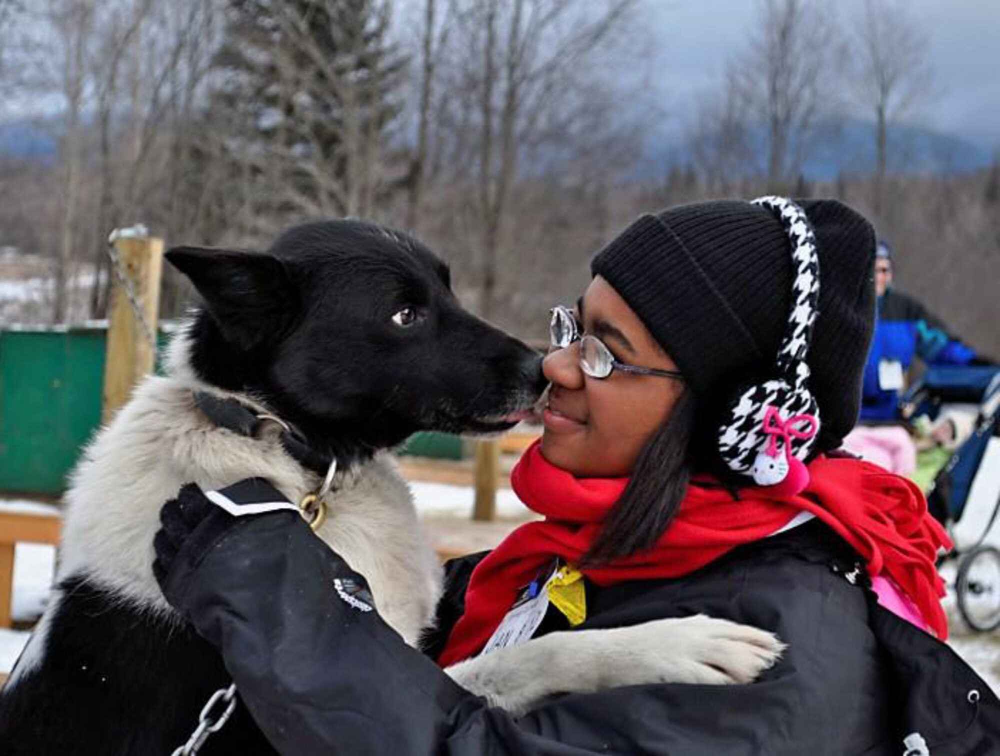 Air Force Reservist Tech. Sgt. Francine Torres, and her visually impaired 17-year-old daughter, Jasmine Polite, shown here, attended a free military-sponsored mountain adventure camp in New Hampshire for military teens with physical disabilities that would change her daughter's life. Along with a dozen other kids from across the U.S., The Torres pair enjoyed many winter activities and adventures they normally wouldn't do. One of their favorites was interacting with the Huskies after a dog-sledding adventure. Torres is an knowledge operations manager with the 920th Rescue Wing, Patrick Air Force Base, Fla. (Courtesy photo)