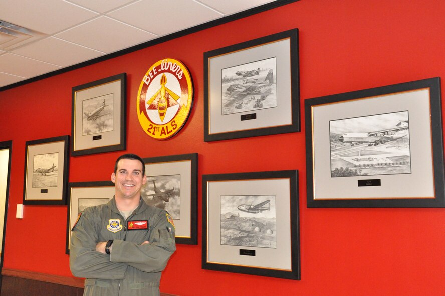 Capt. Nelson Prouty stands Monday in the 21st Airlift Squadron’s lounge.
The pilot has been with the squadron for more than three years. (U.S. Air Force photo/Nick DeCicco)