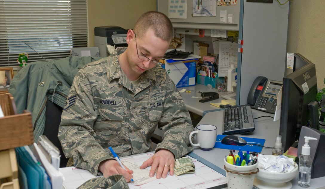 Staff Sgt. Mitch Waddell, 28th Force Support Squadron front desk representative/alternate accountant, works on finances at the Pine Tree Inn on Ellsworth Air Force Base, S.D., Feb. 8, 2012.  The Pine Tree Inn is a non-appropriated funds operation, maintaining its functions by self-generating funds.  (U.S. Air Force photo by Airman 1st Class Anania Tekurio/Released)