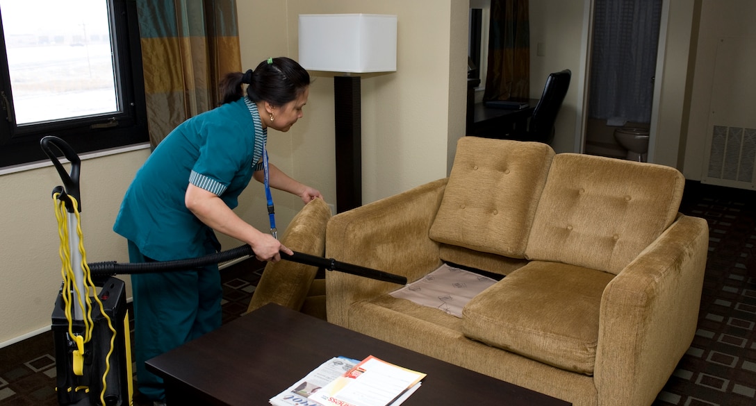 Crispina Meher, Pine Tree Inn housekeeper, is cleaning one of the visitor quarters room at the Pine Tree Inn on Ellsworth Air Force Base, S.D., Feb. 8, 2012.  The Pine Tree Inn is one of three facilities on base that offer visitors to Ellsworth a place to stay.  (U.S. Air Force photo by Airman 1st Class Anania Tekurio/Released)