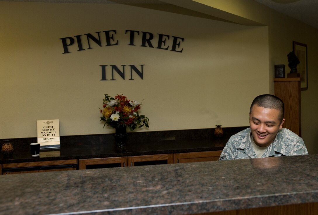 Senior Airman Roldan Corcuera, 28th Force Support Squadron guest service representative, works at the front desk of the Pine Tree Inn on Ellsworth Air Force Base, S.D., Feb. 8, 2012.  As a guest representative, SrA Corcuera provides service to visitors, from reserving rooms to providing guests with base maps and information on local attractions.  (U.S. Air Force photo by Airman 1st Class Anania Tekurio/Released)
