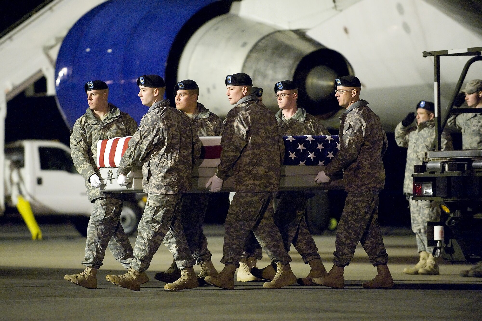 A U.S. Army carry team transfers the remains of Army Pfc. Cesar Cortez, of Oceanside, Calif., at Dover Air Force Base, Del., Feb. 14, 2012. Cortez was assigned to the 5th Battalion, 52nd Air Defense Artillery Regiment, 11th Air Defense Artillery Brigade, 32nd Army Air and Missile Defense Command, Fort Bliss, Texas. (U.S. Air Force photo/Steve Kotecki)
