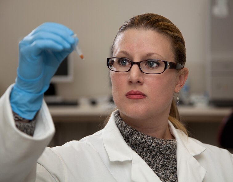 Sarah Torres, David Grant U.S. Air Force Medical Center's Clinical Investigation Facility molecular biologist, looks at a sample before analysis on Oct. 4, 2011, at Travis Air Force Base, Calif. (U.S. Air Force photo/Lt. Col. Robert Couse-Baker)