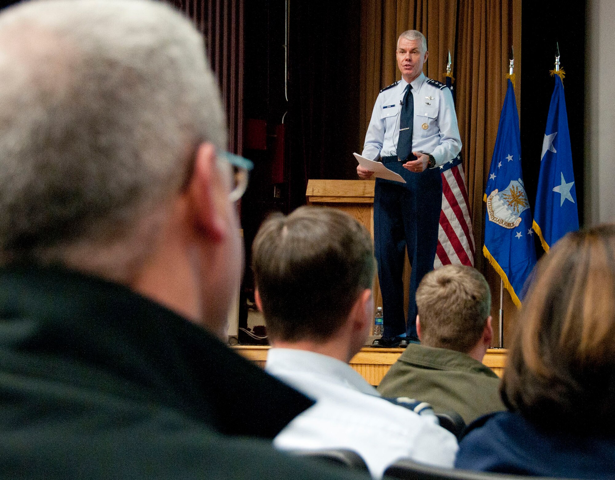Lt. Gen. CR Davis, Electronic Systems Center commander, addresses field grade officers and civilian middle managers during a commander’s call at the base theater Feb. 13. Davis discussed ESC mission area challenges and initiatives. He also said he wants personnel to focus on delivering capabilities rather than process and is looking to the middle managers to help accomplish that.  (U.S. Air Force photo by Mark Wyatt)
