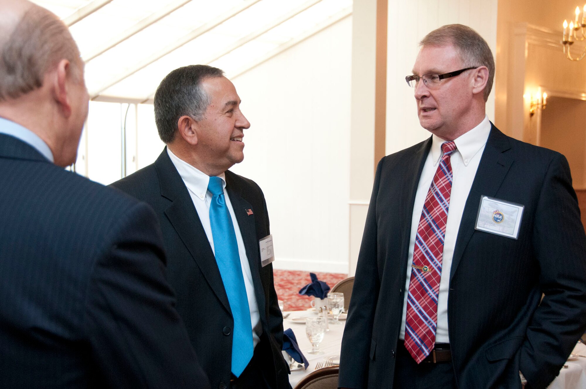 John Lyle (right), Electronic Systems Center director of Contracting, speaks with Joseph Magnone, Northrop Grumman Corp. corporate lead executive, Feb. 13, during the Hanscom Representatives Association meeting at the Minuteman Commons. Lyle's main message as the keynote speaker was how to achieve effective communication between government contracting personnel and industry. (U.S. Air Force photo by Mark Wyatt)