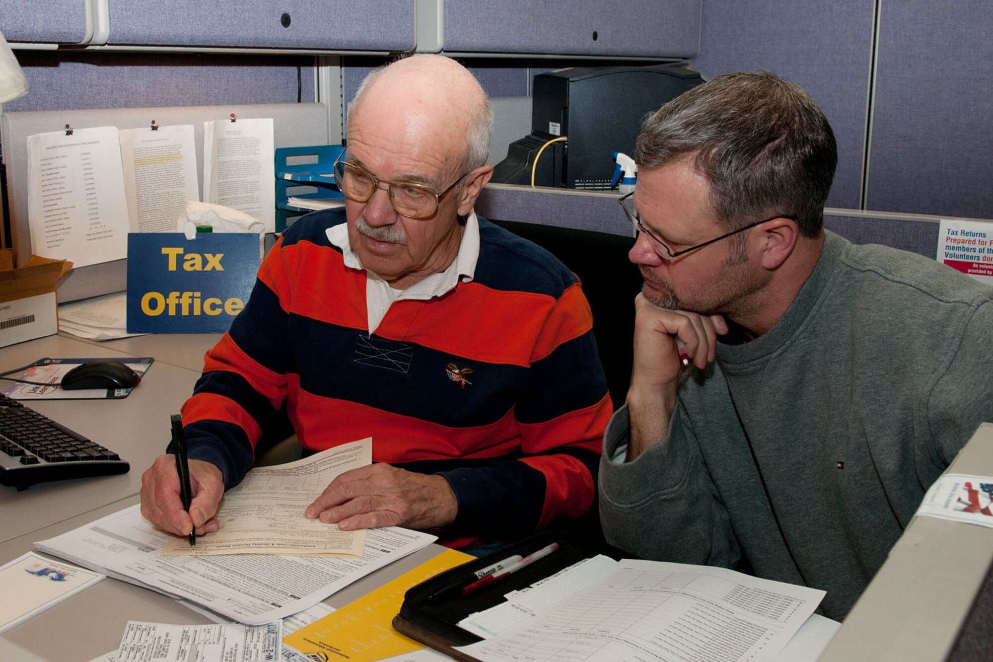 Jim DeZutter prepares David Vail's 2011 income tax return at the Retiree Activity Office in Building 1305 Feb. 7. The Volunteer Income Tax Assistance (VITA) program will provide tax assistance to military members, including active duty and reservists, as well as retirees, on-base civilian employees and dependents. (U.S. Air Force photo by Linda LaBonte Britt)