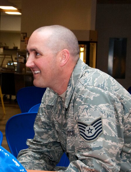 Tech. Sgt. Trevor Harvey, chaplain’s assistant, enjoys the fruits of his labor at the 162nd Fighter Wing prayer breakfast Feb. 12. Harvey, a former professional baseball player, worked to arrange the event that featured several Major League Baseball players who spoke to wing members about their faith. (U.S. Air Force photo/Tech. Sgt. Hollie Hansen)