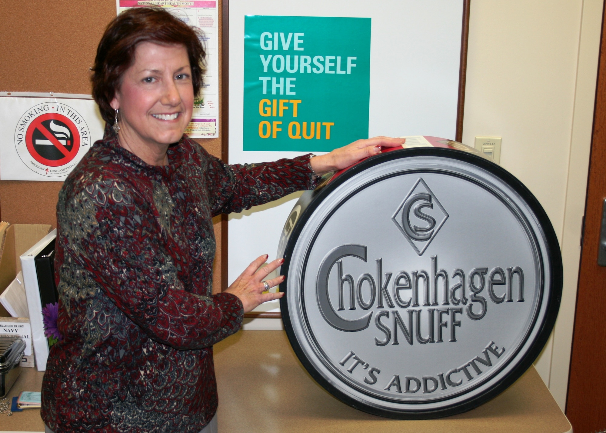 Claudia Dion, Naval Health Clinic Charleston's certified tobacco treatment specialist, discusses the numerous health benefits of quitting tobacco. (U.S. Navy photo/Jeff Kelly) 
