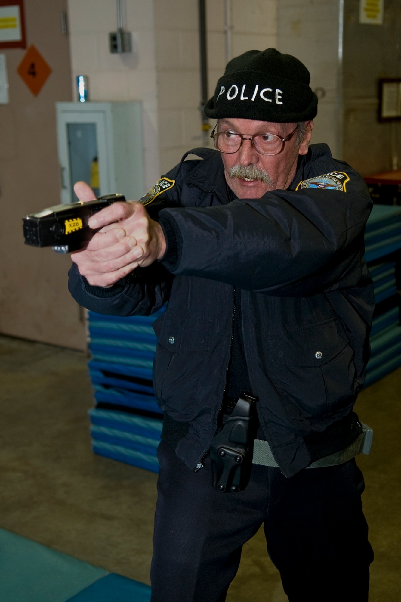 GRISSOM AIR RESERVE BASE, Ind. -- Karl Williams, a Department of Defense police officer, uses an electronic control devices during a special training session held at Grissom ARB.  In the training scenario, Williams warns an individual who is not complying with instructions that the ECD could be used.  Several 434th Security Forces Squadron personnel were trained on the use of ECDs, which will become part of the resources available to on-duty security forces personnel.  (U.S. Air Force photo/Tech. Sgt. Mark R. W. Orders-Woempner)