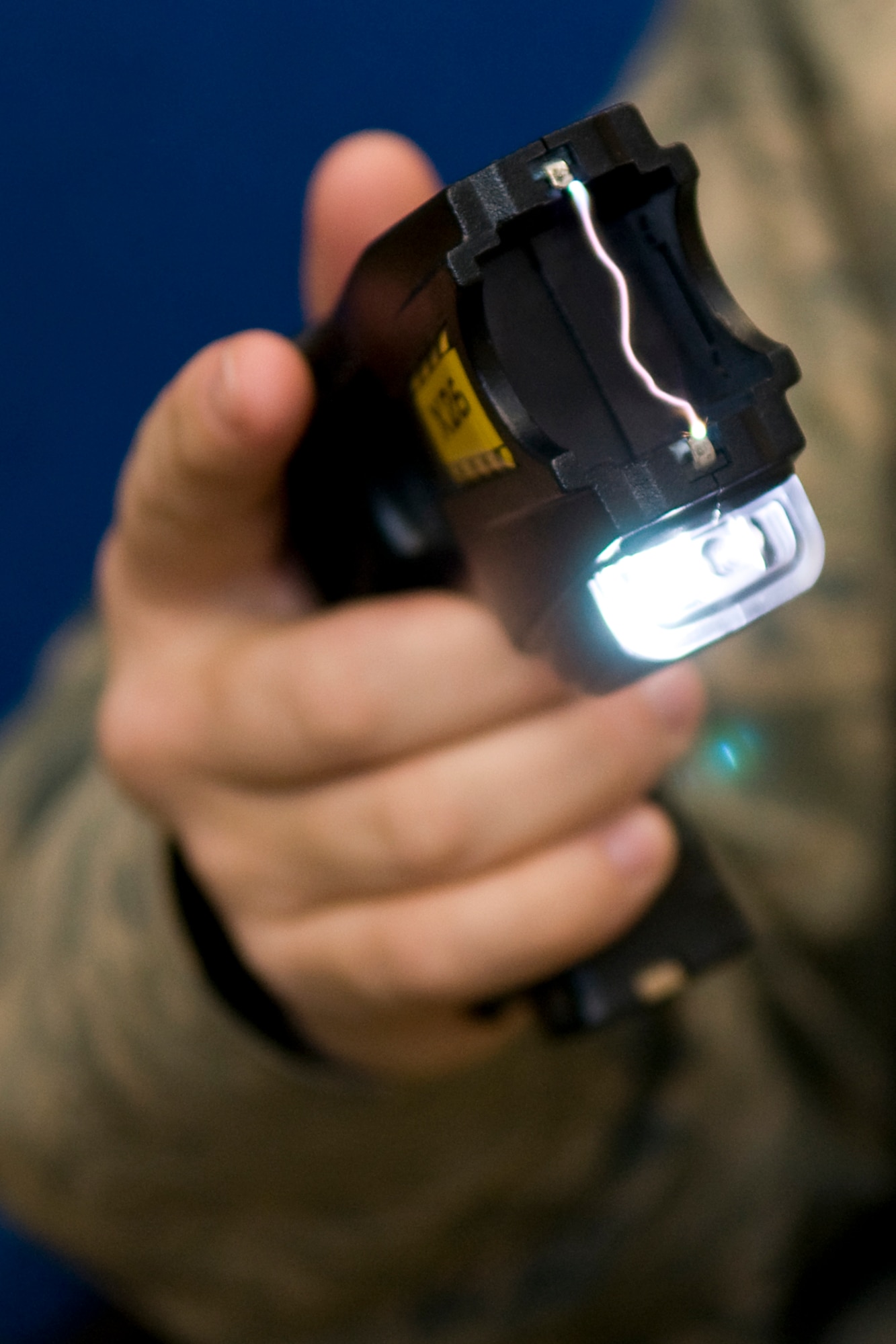 GRISSOM AIR RESERVE BASE, Ind. -- Staff Sgt. Justin Coe, a 434th Security Forces Squadron security response team member, test fires an electronic control device during a training exercise Jan. 27. All 434th SFS members who could carry an ECD as part of their duty were trained on the devices, which will be worn by Grissom's on-duty security force officers no later than April 1. (U.S. Air Force photo/Tech. Sgt. Mark R. W. Orders-Woempner) 
