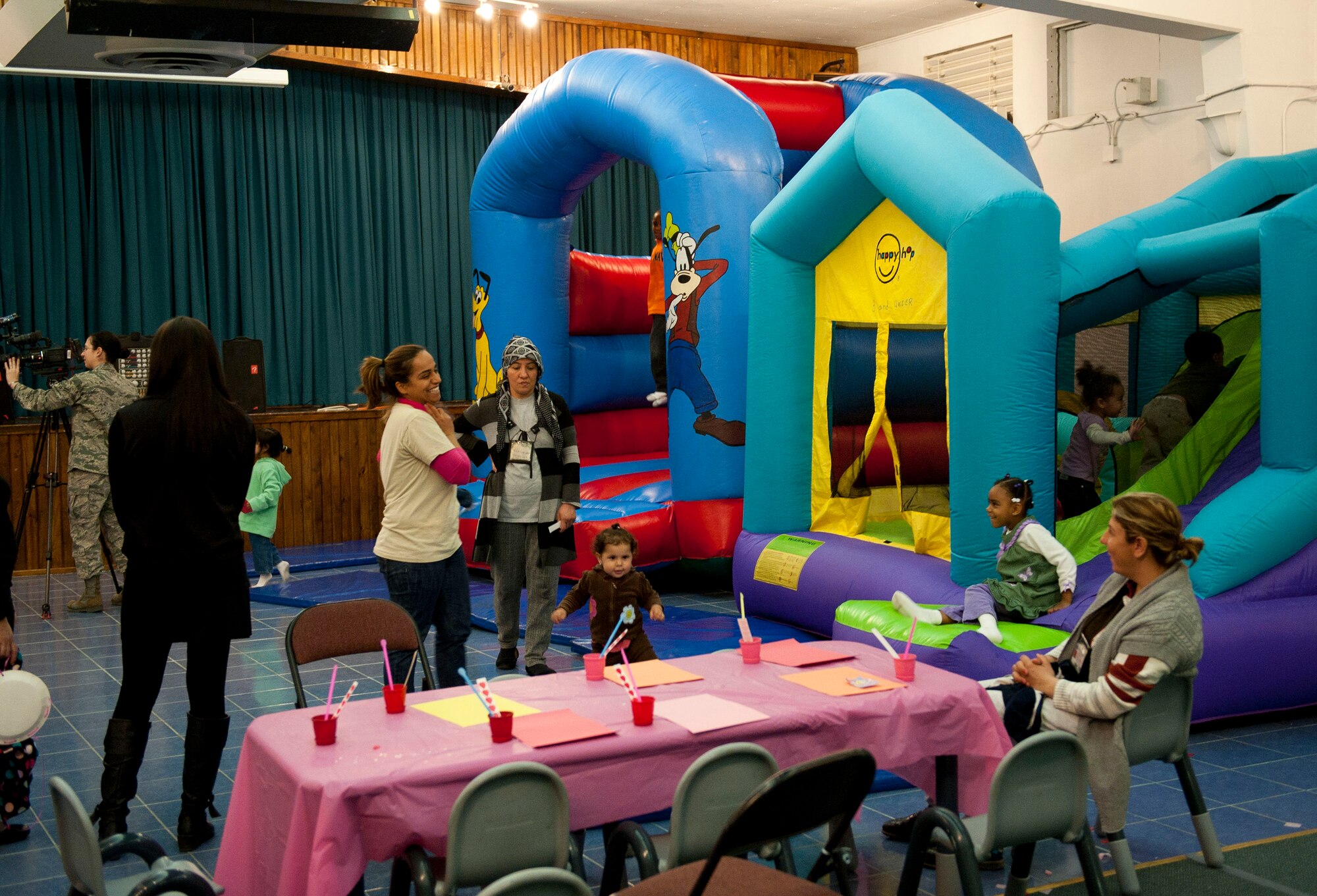 Children enjoy bouncy castles during the Mommy and Me Forever Yours Valentine's workshop Feb. 14, 2012, at Incirlik Air Base, Turkey. The workshop gave mothers the chance to spend time with their children making arts and crafts at the community center. (U.S. Air Force photo by Senior Airman Clayton Lenhardt/Released)