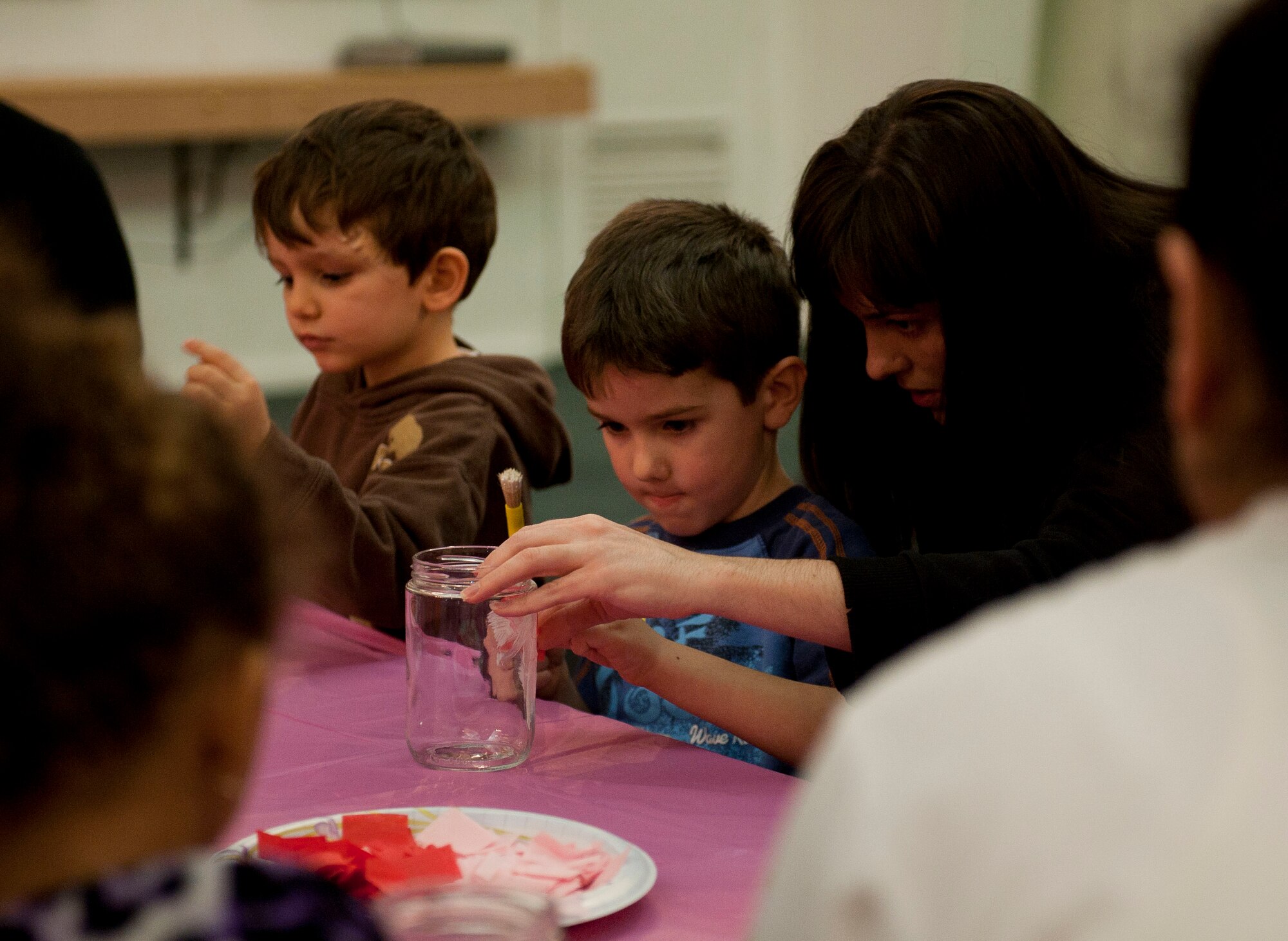 Anna Beard helps her son with arts and crafts during the Mommy and Me Forever Yours Valentine's workshop Feb. 14, 2012, at Incirlik Air Base, Turkey. The workshop gave mothers the chance to spend time with their children making arts and crafts at the community center. (U.S. Air Force photo by Senior Airman Clayton Lenhardt/Released)