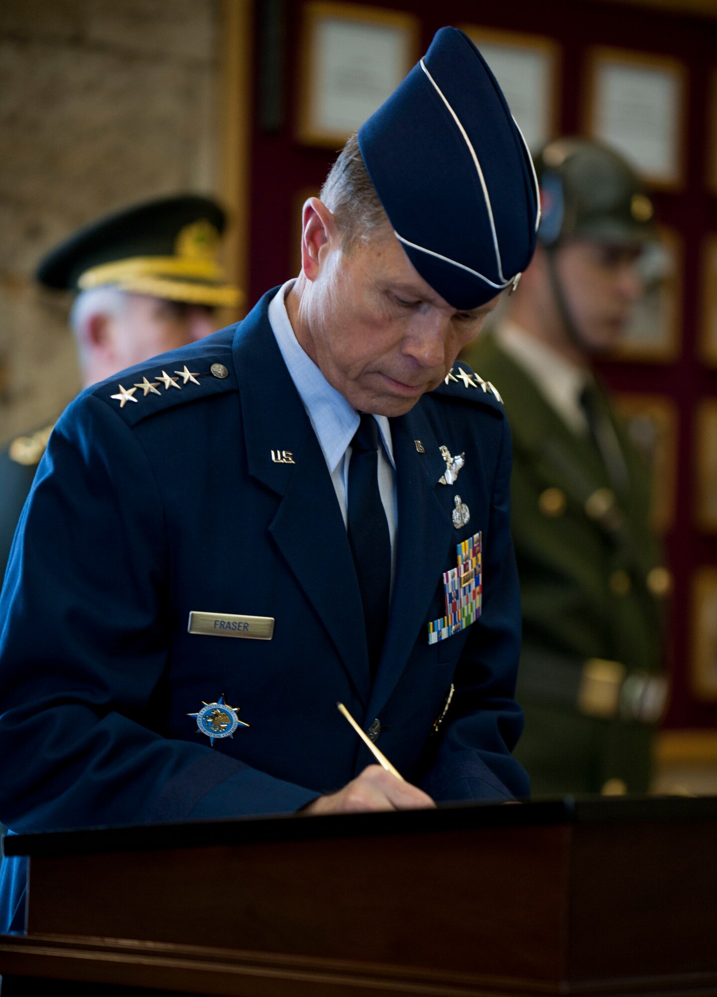 Gen. William M. Fraser III, U.S. Transportation Command commander, signs the visitors log at Mustafa Kemal Ataturk’s memorial and mausoleum following a wreath-laying ceremony Feb. 9, 2012, in Ankara, Turkey. Fraser travelled to Ankara to participate in the ceremony that honors Ataturk, the founder of the Republic of Turkey.(U.S. Air Force photo by Senior Airman Clayton Lenhardt/Released)