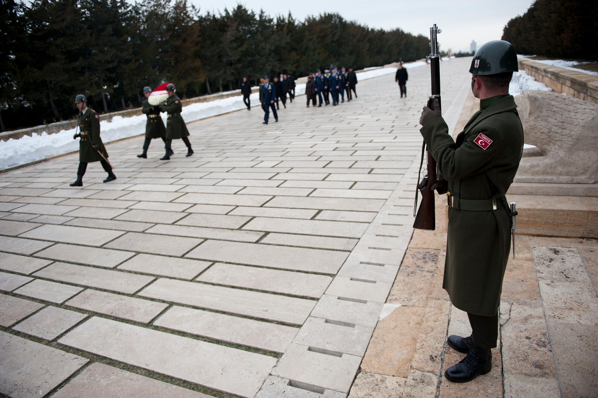 A Turkish service member watches as a U.S. and Turkish military procession passes during a wreath-laying ceremony at Mustafa Kemal Ataturk’s memorial and mausoleum Feb. 9, 2012, in Ankara, Turkey. Gen. William M. Fraser III, U.S. Transportation Command commander, travelled to Ankara to participate in the ceremony that honors Ataturk, the founder of the Republic of Turkey.(U.S. Air Force photo by Senior Airman Clayton Lenhardt/Released)