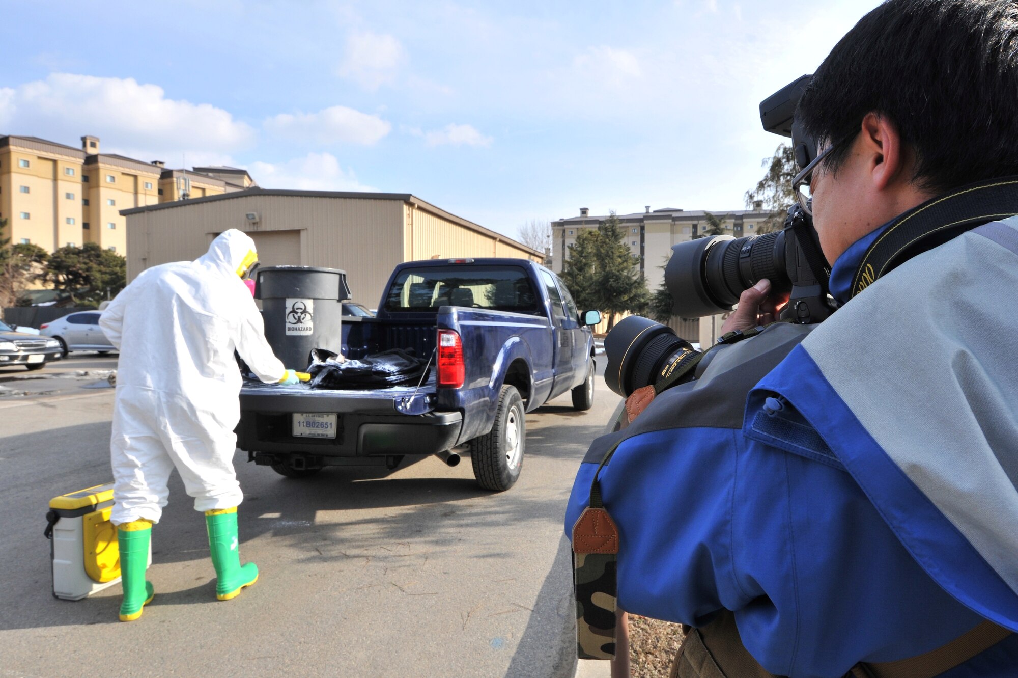 Staff Sgt. Samuel Mericle, 8th Medical Support Squadron bioenvironmental technician, performs an unknown radiation and chemical agent detection demonstration for photojournalists from Defense Times Korea at Kunsan Air Base, Republic of Korea, Feb. 10, 2012. Kunsan Airmen will be featured in the March issue of Defense Times Korea. (U.S. Air Force photo by Senior Airman Brittany Y. Auld/Released)