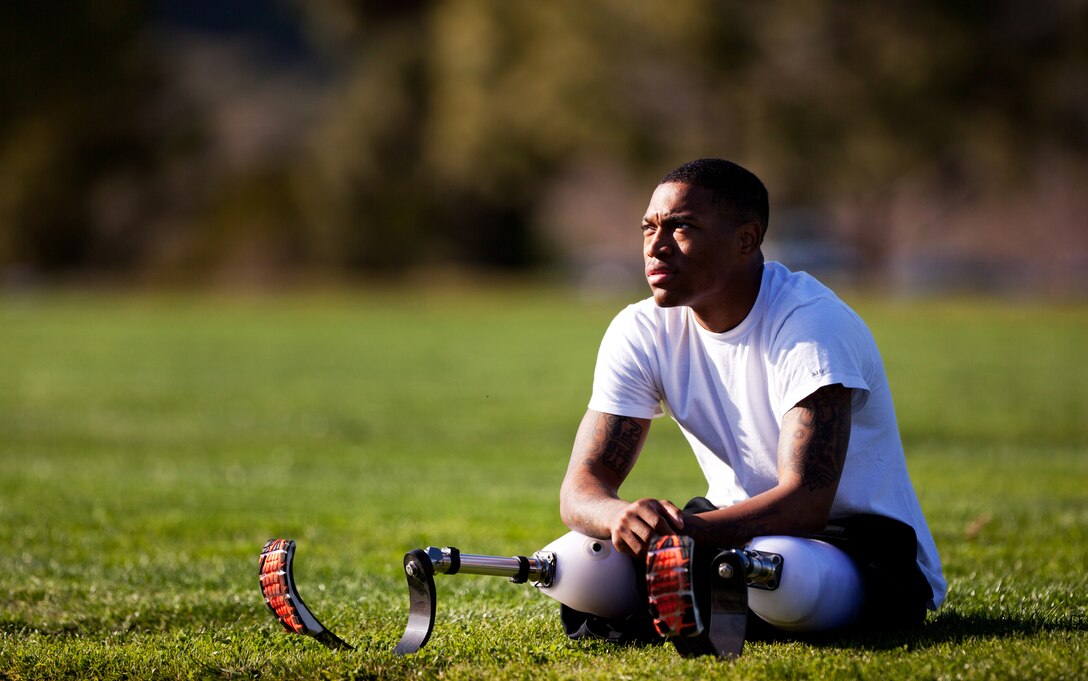 Cpl. Anthony McDaniel stretches before practice for the 2012 Marine Corps Trials at Marine Corps Base Camp Pendleton, Calif., Feb. 14. McDaniel, a bilateral leg amputee and below-elbow amputee, will compete in the track and wheelchair basketball competitions during the trials. McDaniel, an artilleryman, was injured after stepping on an improvised explosive device Aug. 31, 2010. McDaniel is one of more than 300 injured Marines, veterans and allies are competing in the second annual trials, which include swimming, wheelchair basketball, sitting volleyball, track and field, archery, cycling and shooting. The top 50 performing Marines will earn the opportunity to compete in the Wounded Warrior Games in Colorado Springs in May.