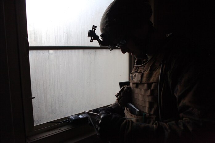 A Marine squad leader with Charlie Company, Battalion Landing Team 1st Battalion, 2nd Marine Regiment, 24th Marine Expeditionary Unit, checks his map during a training raid at Camp Lejeune’s Military Operations in Urban Terrain Compound, Feb.  15. The raid was part of Certification Exercise (CERTEX) - the final at-sea training exercise for the 24th MEU with the Iwo Jima Amphibious Ready Group which took place Jan. 27-Feb. 16, and included a series of missions intended to evaluate and certify the units for their upcoming deployment.