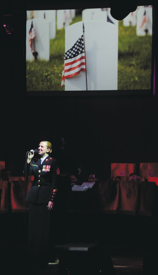 Staff Sgt. Terri Kopetzki, clarinetist and public affairs representative, Albany Marine Band, sings “There She Stands,” during the Albany Marine Band’s final concert at the Albany Municipal Auditorium in Albany, Ga., Tuesday.