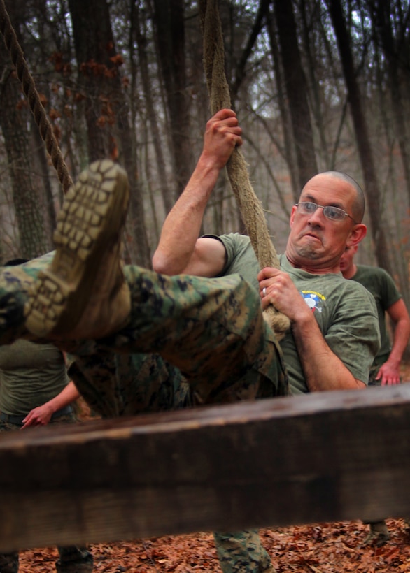 Sgt. Jim-Paul Adams, a section leader with Battery B, 2nd Low Altitude Air Defense Battalion, executes the “Swing, Stand and Jump,” obstacle of the confidence course aboard Virginia Army National Guard Installation Fort Pickett, V.A., Feb. 15. The LAAD Marines are conducting a two-week-long field operation dubbed South Bound Trooper through Feb. 26, and they ran this two-and-a-half mile course in the rain executing various obstacles to work on team building and camaraderie.