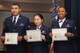 Airman 1st Class Jose Silva-Cruz, 27th Special Operations Civil Engineer Squadron, Airman 1st Class Cheng Bi, 27th Special Operations Logistics Readiness Squadron and Airman 1st Class Giselle Wells, 27 SOCES, stand with their certificates of naturalization at the Landing Zone at Cannon Air Force Base, N.M., Feb. 16, 2012. Individuals must normally wait five years before applying to become a U.S. citizen, however, if they are serving in the armed forces during a time of war that requirement can be waived. (U.S. Air Force Photo by Airman 1st Class Xavier Lockley)