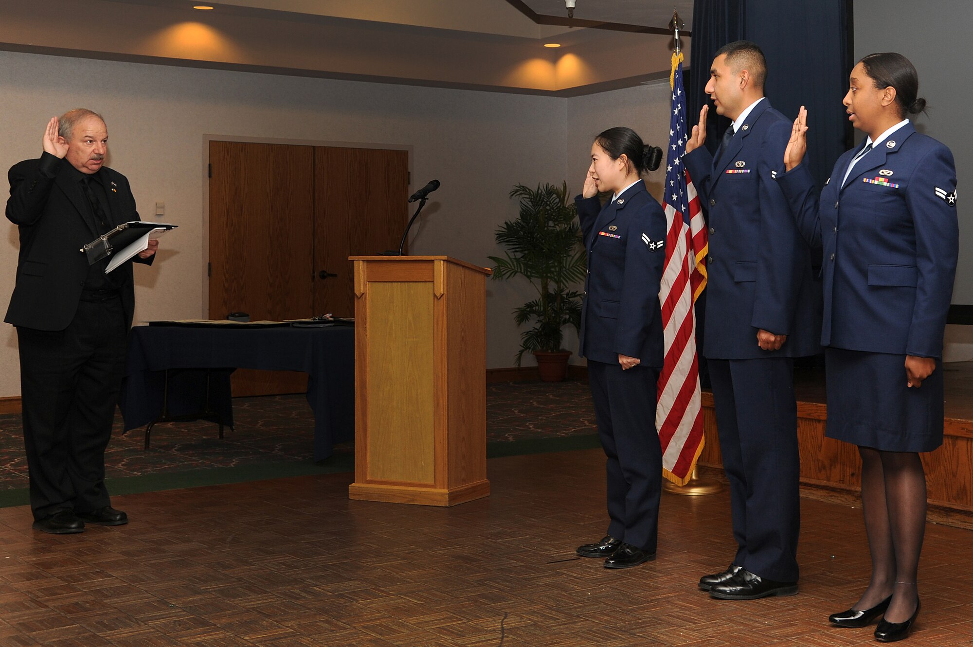 Three Air Commandos earned their U.S. citizenship during a ceremony at the Landing Zone at Cannon Air Force Base, N.M., Feb. 16, 2012. Individuals must normally wait five years before applying to become a U.S. citizen, however, if they are serving in the armed forces during a time of war that requirement can be waived. (U.S. Air Force Photo by Airman 1st Class Xavier Lockley)