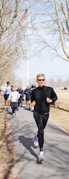 KIRTLAND AFB, N.M. -- Matthew Shike, Joint Navigation Warfare Center, leads the pack Tuesday during the Valentine’s Day 5K Run/Walk at Hardin Field. (Photo by Jonathan Rejent)