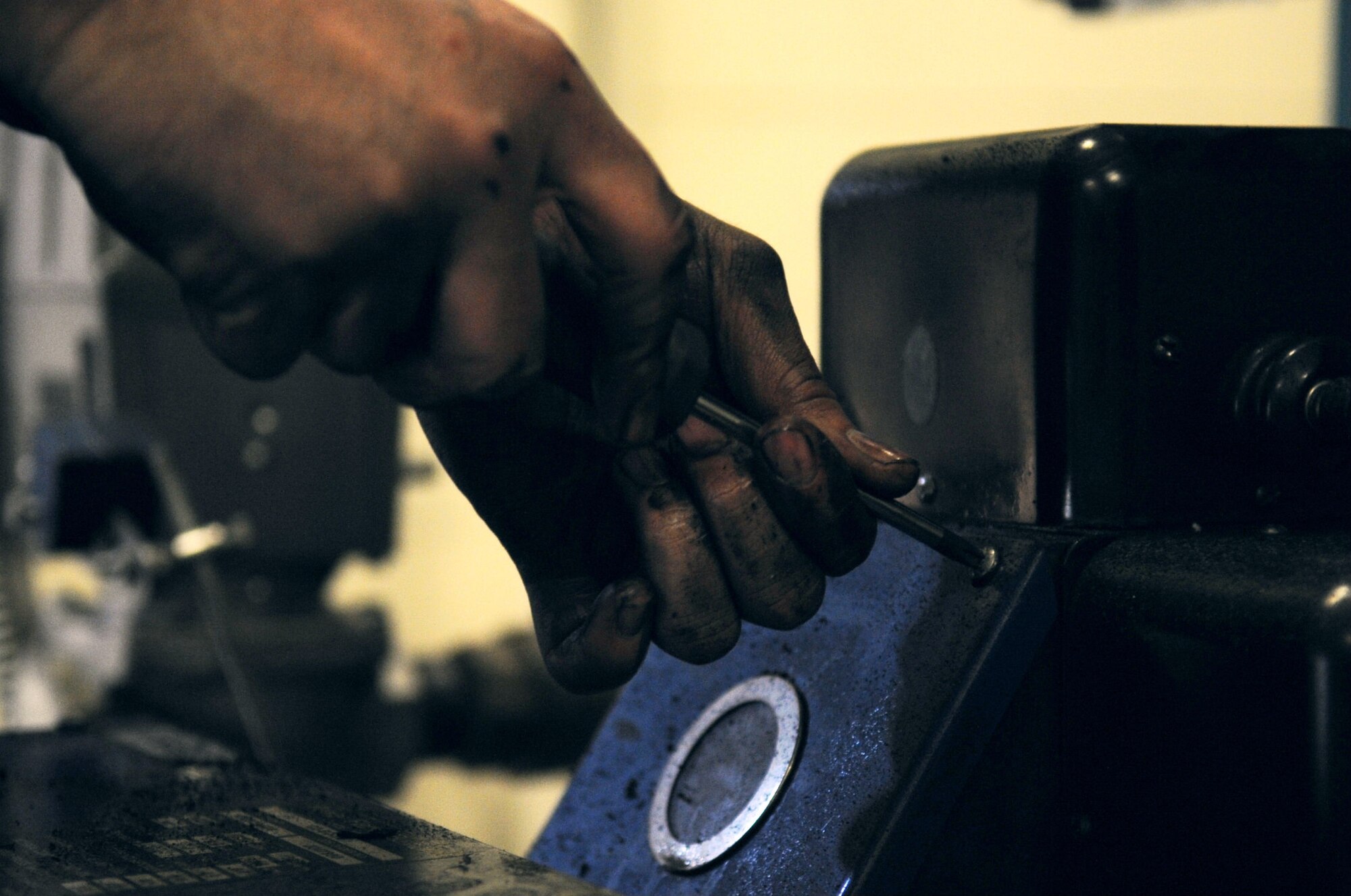 Staff Sgt. Alexander Angel, 8th Civil Engineer Squadron heating, ventilation, air conditioning and refrigeration technician, takes a screw out of a boiler Feb. 15, 2012, at Kunsan Air Base, Republic of Korea, during annual maintenance. Angel, who was named "Pride of the Pack" along with fellow HVACR technician Airman 1st Class Jonathan Pears, said he loves the hands-on nature of his job. (U.S. Air Force photo by Senior Airman Brigitte N. Brantley/Released)