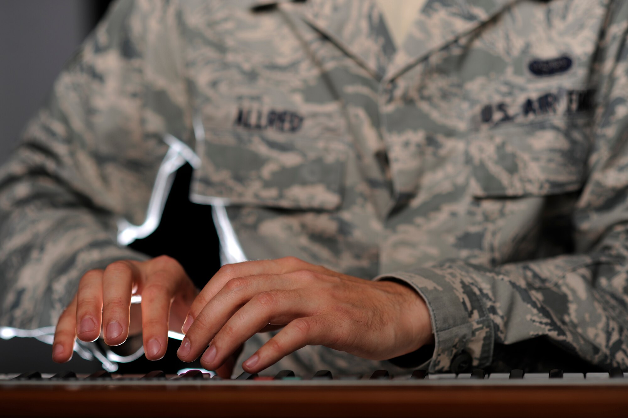 VANDENBERG AIR FORCE BASE, Calif. -- Airman 1st Class Alex Allred, 614th Air and Space Operations Center knowledge operator, illustrates his performance with Tops in Blue here Monday, Feb. 13, 2012. Allred plays a multitude of instruments, but will be playing the piano in Tops in Blue. (U.S. Air Force illustrative photo/Staff Sgt. Andrew Satran) 

 