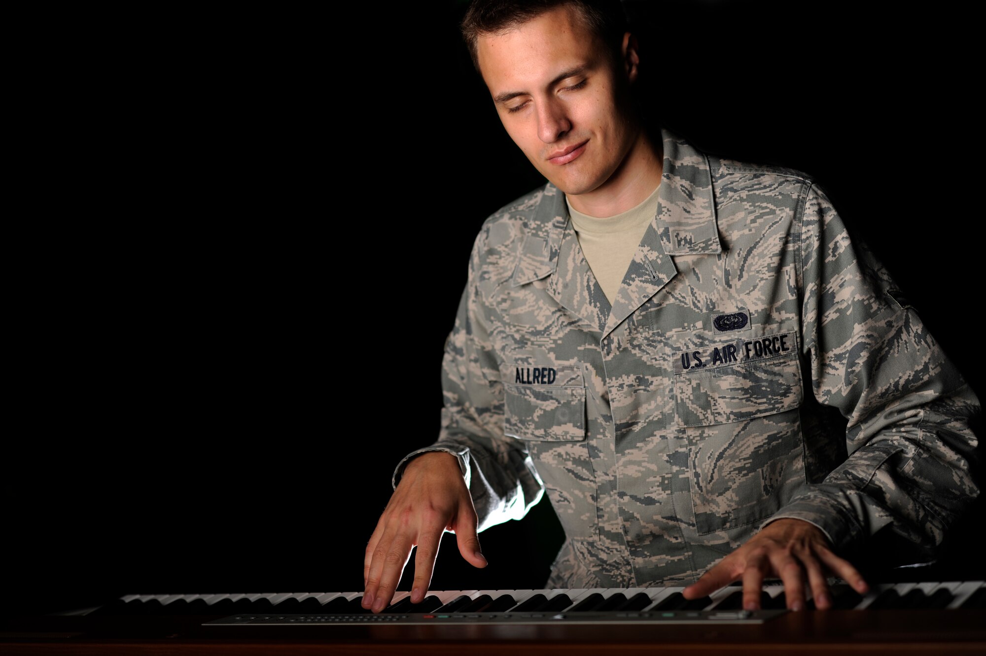 VANDENBERG AIR FORCE BASE, Calif. -- Airman 1st Class Alex Allred, 614th Air and Space Operations Center knowledge operator, illustrates his performance practice for Tops in Blue here Monday, Feb. 13, 2012. Allred was selected to be in the 35-member Tops in Blue group to provide entertainment for military members worldwide. (U.S. Air Force illustrative photo/Staff Sgt. Andrew Satran) 

 