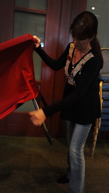 Carole Sturgeon, 22nd Force Support Squadron event coordinator, prepares for a McConnell Officers’ Spouses Club function at the Robert J. Dole Community Center Feb 16, 2012, McConnell Air Force Base, Kan. As an event coordinator, Sturgeon is responsible for arranging catered events, maintaining reservations and contracts, inspecting final arrangements and observing events in operation. (U.S. Air Force photo/ Airman 1st Class Jose Leon)