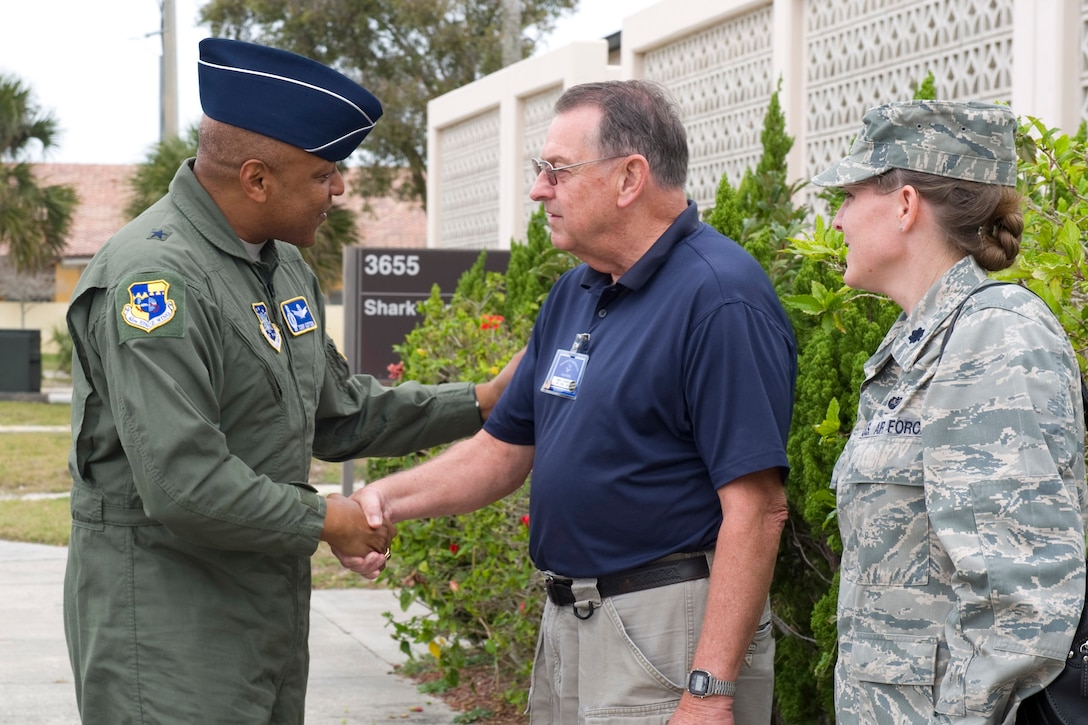 Mr. Don Winterich, director of the Volunteer Income Tax Assistance (VITA) Program, and Lt. Col. Jennifer Cline, 45th Staff Judge Advocate, welcome Brig. Gen. Anthony Cotton, 45th Space Wing commander, to the Tax Center Feb. 3, 2012. VITA provides free income tax return preparation for all Active Duty, Reserve, and Retired Military and Civilian Personnel of the Patrick AFB community, Monday through Friday, 9 a.m. - 5 p.m., inside the south entrance of the Shark Center. Appointments can be made by calling (321) 494-4718; leave a name and phone number on the answering service. (U.S. Air Force photo/Matthew Jurgens)