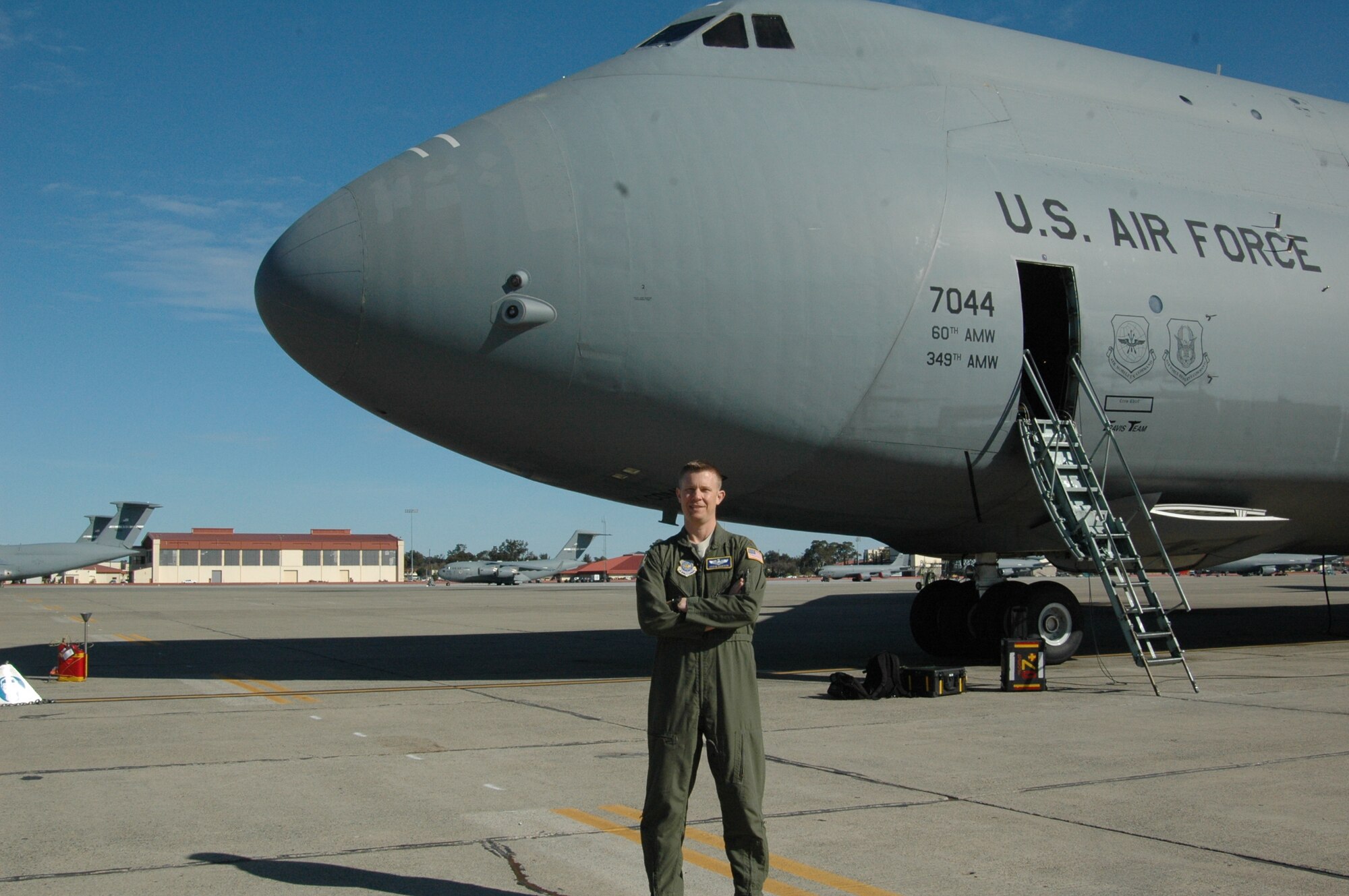 Maj. Stephen Dawson, Director of Staff deputy director and 21st Airlift Squadron pilot, stands in front of a C-5 Galaxy Thursday, on the Travis flightline. (U.S. Air Force photo/Tyler Grimes)