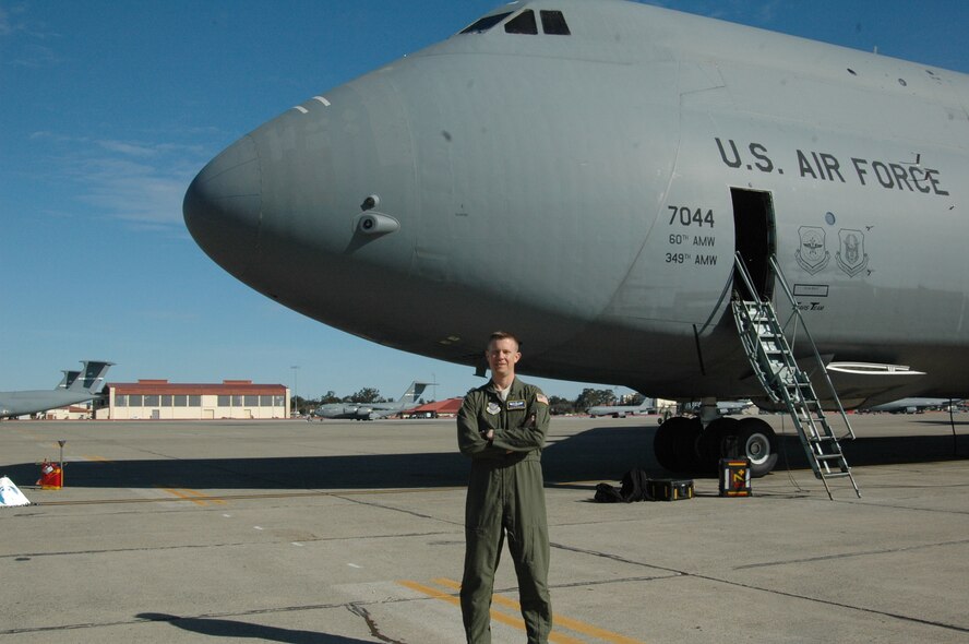 Maj. Stephen Dawson, Director of Staff deputy director and 22nd Airlift Squadron pilot, stands in front of a C-5 Galaxy Thursday, on the Travis flightline. (U.S. Air Force photo/Tyler Grimes) 

