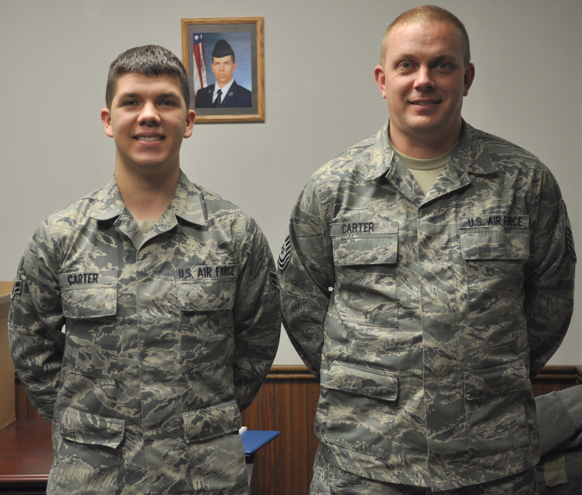 Airman 1st Class Terry Carter III, 375th Communications Squadron server
administrator, and Master Sgt. Terry Carter, 375th Logistics Readiness
Squadron vehicle fleet manager, are both stationed at Scott Air Force Base.
Both father and son did not expect to get stationed together, but have taken
advantage of the opportunity by eating lunch together and sharing hobbies.
(U.S. Air Force photo/Senior Airman Amber R. Kelly-Herard)
