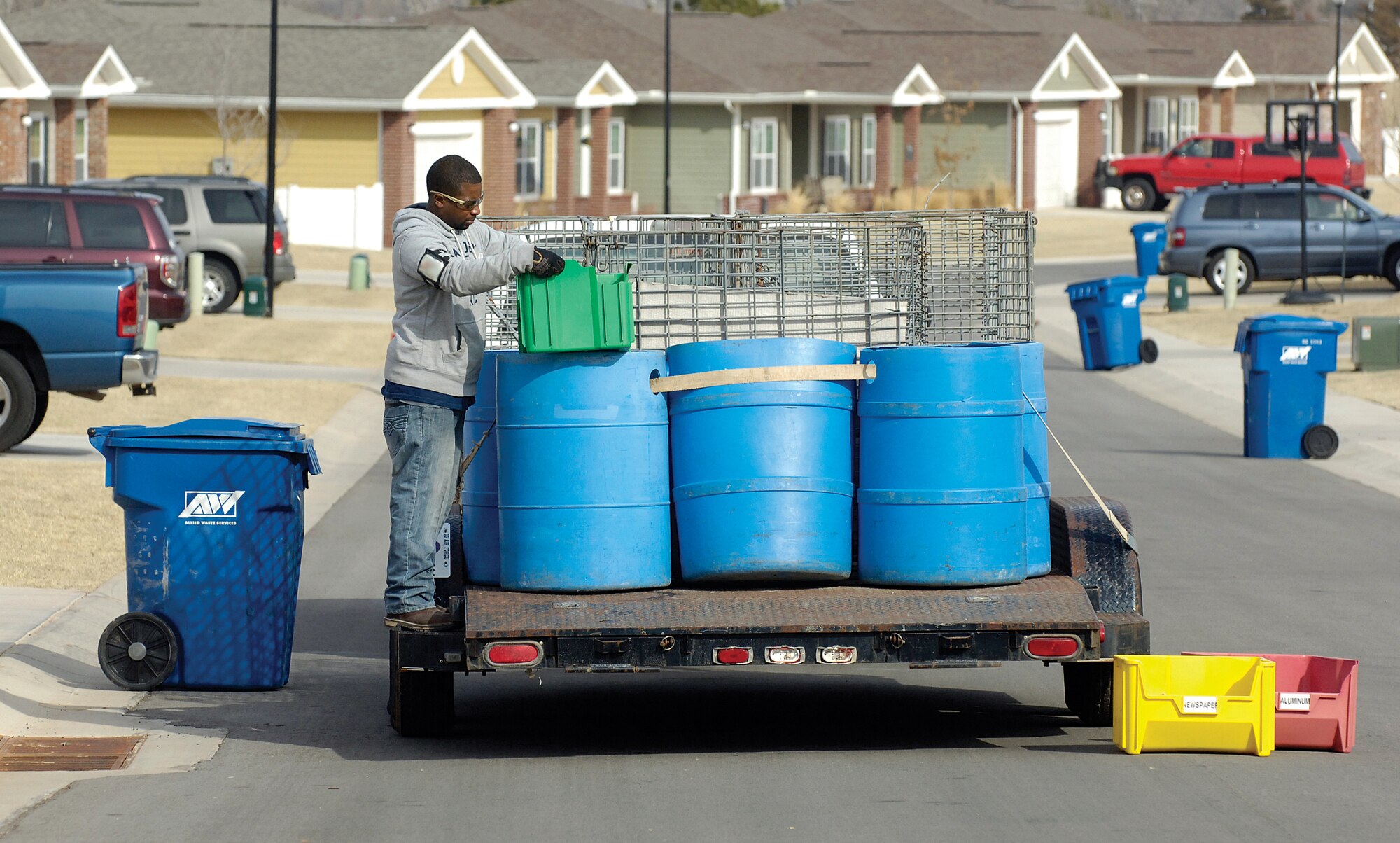 Qualified Recycling Program material examiner Michael Holmes with the 72nd Force Support Squadron collects materials for recycling during his weekly route through Tinker’s base housing. Curbside recycling is a small part of Tinker’s recycling efforts. (Air Force photo by Margo Wright)