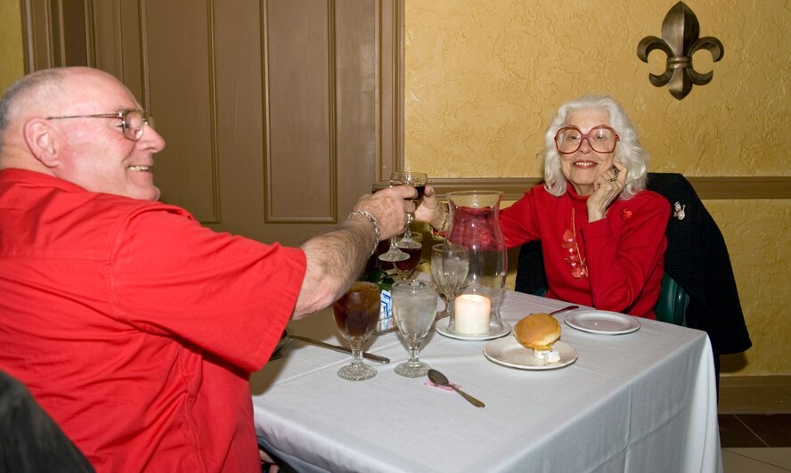 Retired Air Force Maj. Carl Pampe and Elizabeth Hetto toast to Valentine's Day on Barksdale Air Force Base, La., Feb. 14. While it did not start out as a romantic holiday, Valentine's Day eventually evolved into the day where couples expressed their love for each other.  (U.S. Air Force photo/Airman 1st Class Benjamin Gonsier)(RELEASED)