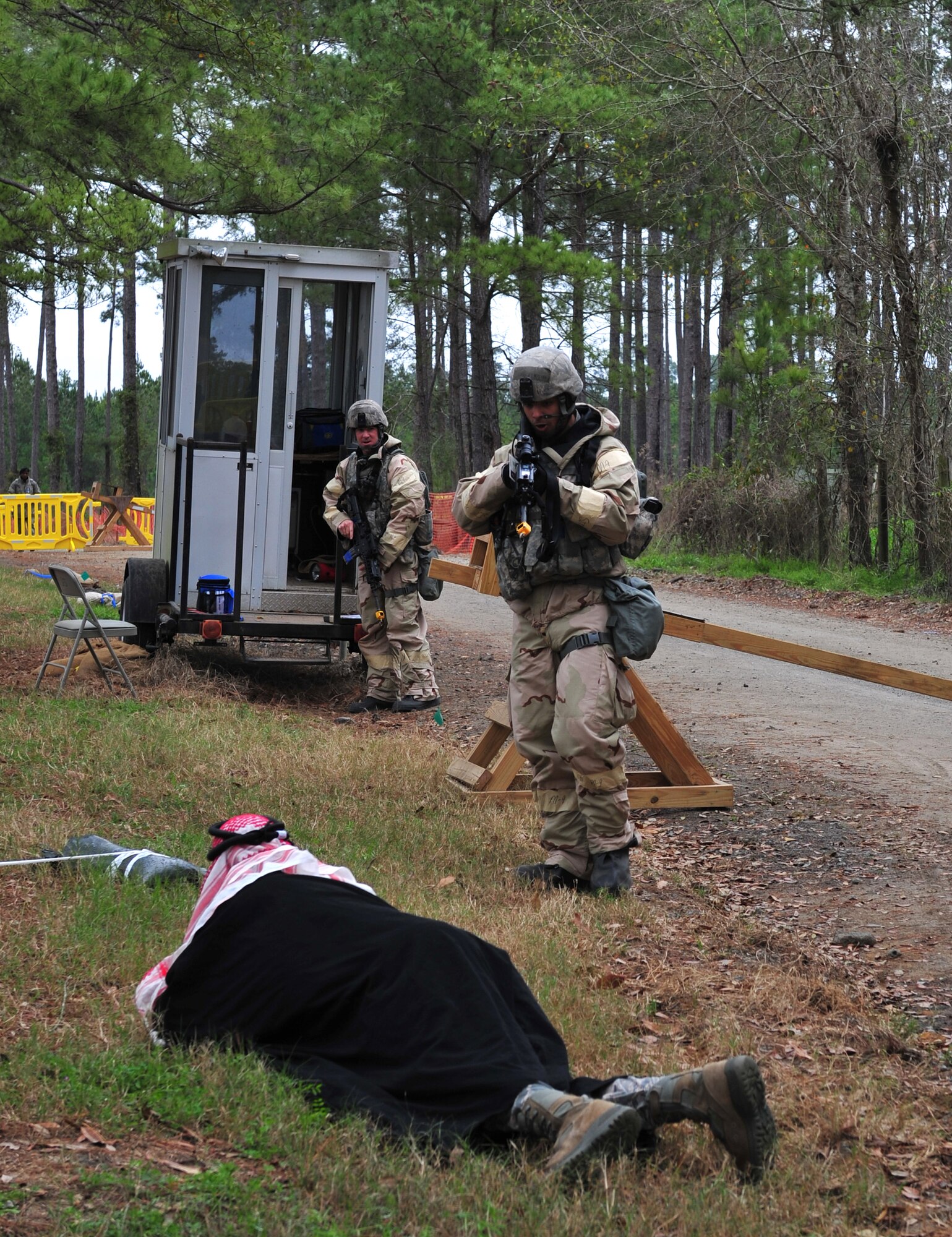 U.S. Air Force Senior Airman Gregory Walker, 23d Security Forces Squadron fire team member, orders a suspicious driver to get out of his vehicle and to get on the ground during a phase II operation readiness exercise at Moody Air Force Base, Ga., Feb. 15, 2012. The suspicious driver was trying to gain access to the exercise site while carrying a vehicle born improvised explosive device in his truck. (U.S. Air Force photo by Staff Sgt. Stephanie Mancha/Released)
