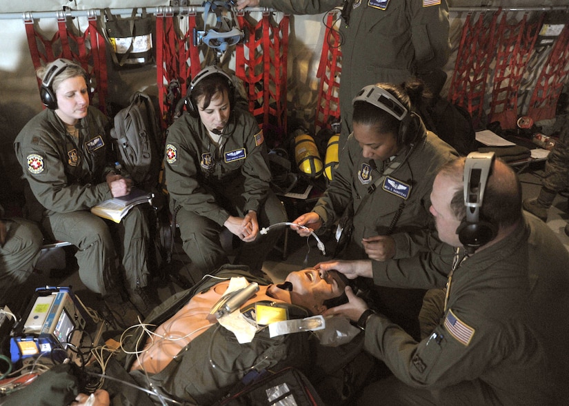 Capt. Meia Rabotaeu, 459th Aeromedical Squadron flight nurse, inserts an uncuffed tracheal tube into a simulated patient during a training exercise aboard a KC-135 Stratotanker high above the Carolinas Feb. 10. The exercise was conducted during an aerial refueling mission. (U.S. Air Force photo/Airman Aaron Stout)