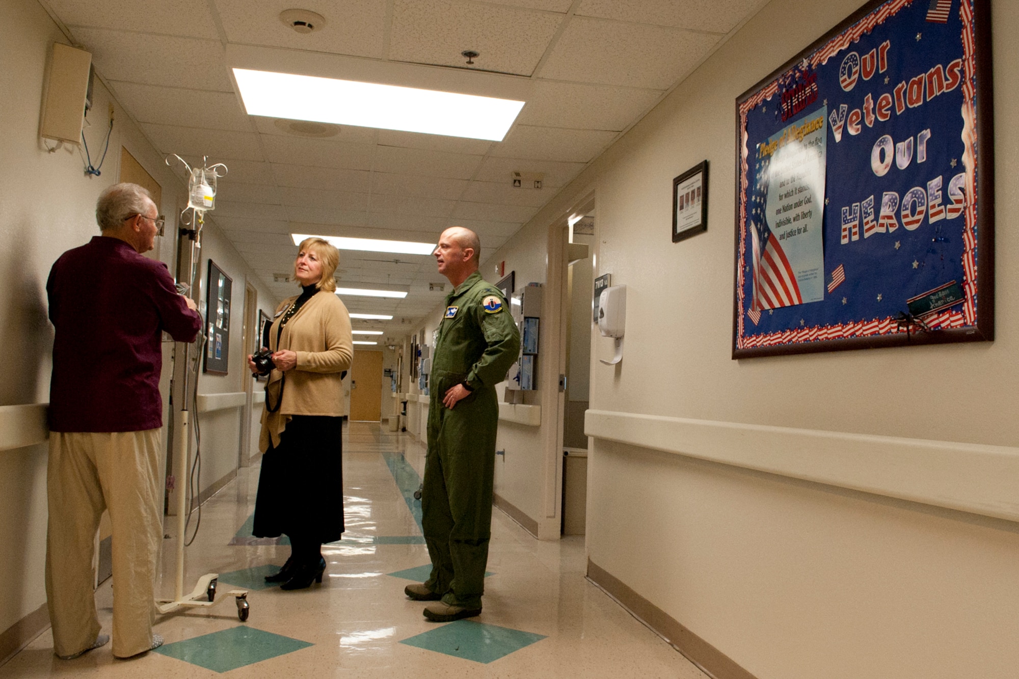 U.S. Air Force Col. Jonathan Ellis, 307th Bomb Wing commander, and Sandy Franks, Veterans Administration public affairs officer, talk with Bill Phillips, a patient at the Overton Brooks Veterans Administration Medical Center, Shreveport, La., Feb. 15, 2012. As tthe nation's largest integrated health care system, VA operates more than 1,400 sites of care, including hospitals, community clinics, community living centers, domiciliaries, readjustment counseling centers, and various other facilities. (U.S. Air Force photo by Master Sgt. Greg Steele/Released)