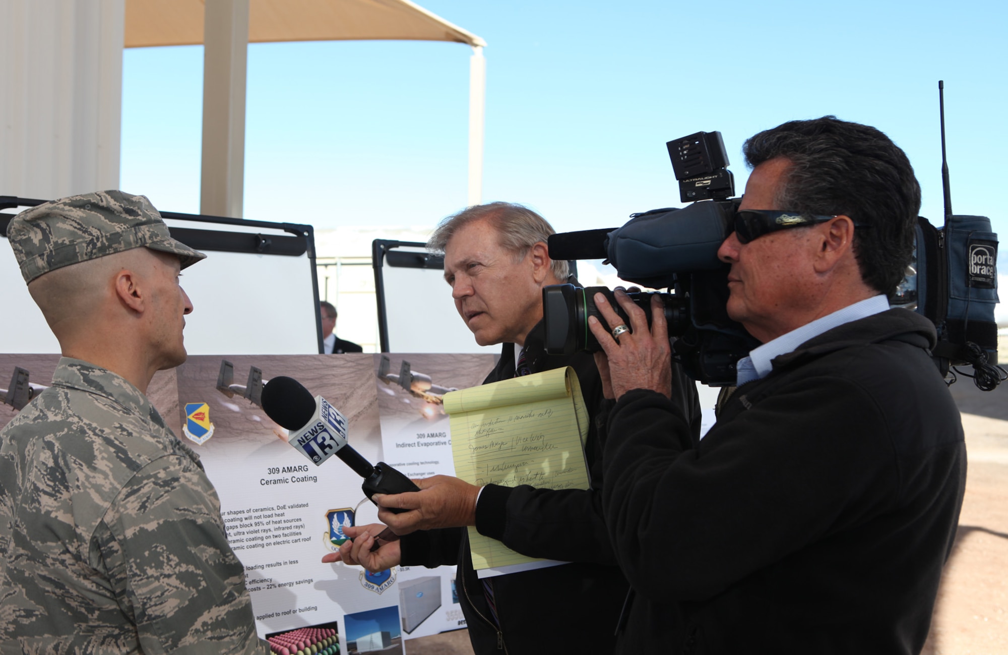 A military member from the 309th Aerospace Maintenance and Regeneration Group speaks to media during the visit of White House energy officials to Davis-Monthan Air Force Base, Ariz., Feb. 3, 2012. White House officials, along with the Tucson mayor, were briefed on the base’s clean energy projects. (Courtesy photo)