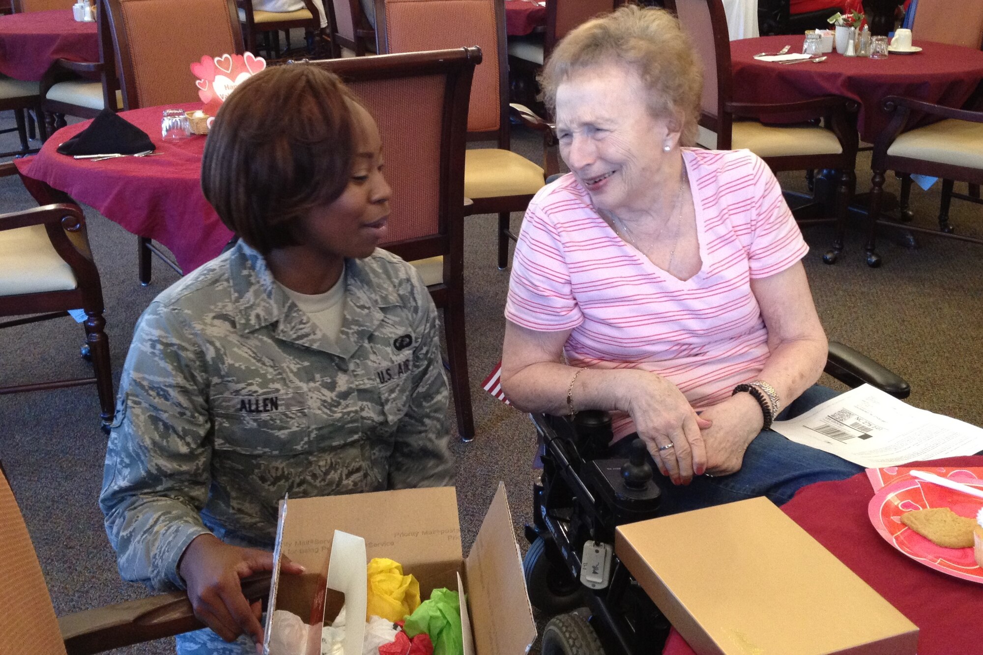U.S. Air Force Airman 1st Class Alexis Allen visits with a resident of The Pines during a Valentines for Veterans event in Goldsboro, N.C., Feb. 14, 2012. Allen participated in this event because she had grandparents who lived in an assisted living community and wanted a chance to interact with military retirees. Allen, 4th Comptroller Squadron budget and analysis technician, hails from Pickens, S.C. (U.S. Air Force photo/Tech. Sgt. Tammie Moore/Release)
