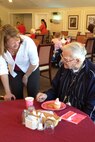 Sam Malpass visits with Harold Arthur at The Pines during a Valentines for Veterans event in Goldsboro, N.C., Feb. 14, 2012. Arthur, a resident, of The Pines is a World War II veteran. Malpass is a 4th Aerospace Medicine Squadron public health technician and the wife of U.S. Air Force Chief Master Sgt. Blake Malpass, 4th Fighter Wing command chief. (U.S. Air Force/Tech. Sgt. Tammie Moore/Released)