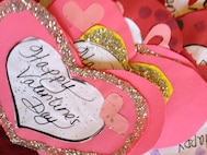 A batch of Valentine’s Day cards made by children at the installation’s child development and youth centers await delivery to residents of The Pines, a retirement community, in Goldsboro, N.C., Feb. 14, 2012. Airmen and 4th Fighter Wing key spouses spent Valentine’s Day socializing with retired veterans, their spouses and members of local retirement communities as part of the Valentines for Vets program. (U.S. Air Force photo/Tech. Sgt. Tammie Moore/Released) 