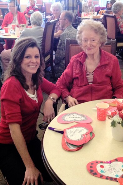 Dee Dee Doherty poses for a photo with a resident of the The Pines during a Valentines for Veterans event in Goldsboro, N.C., Feb. 14, 2012. Representatives from Seymour Johnson Air Force Base visited The Pines, The Sterling House and Goldsboro Assisted Living Center to deliver Valentines cards made by children at the installation’s child development and youth centers. Doherty, 4th Fighter Wing command spouse, is the wife of U.S. Air Force Col. Patrick Doherty the wing commander. (U.S. Air Force photo/Tech. Sgt. Tammie Moore/Released) 