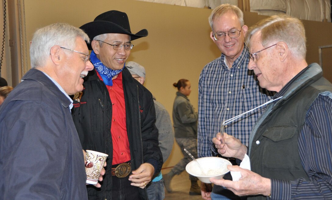 Ambassador Sichan Siv (left center) and Gomer Custer (far right), both 433rd Honorary Commanders, chat with Colonel William Blanchette, Commander, 433rd Airlift Wing Medical Group and Garry West during the Alamo Wing's 12th annual Cowboy Breakfast, Feb. 16. The breakfast is held every year during San Antonio's Stock Show and Rodeo. (U.S. Air Force photo/ Senior Airman Viola M. Hernandez) 