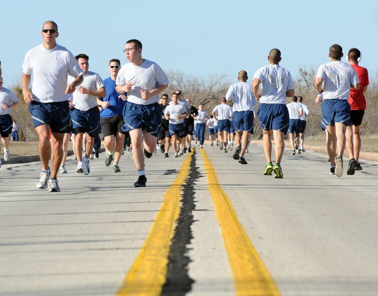 Airmen participate in the Sweetheart Run Feb. 14, 2011, at Dyess Air Force Base, Texas. The 7th Force Support Squadron Fitness Center hosts the run every year to encourage good health during the holiday. For more information about future events, call the Fitness Center at (325) 696-4306. (U.S. Air Force photo by Airman 1st Class Jonathan Stefanko/ Released)