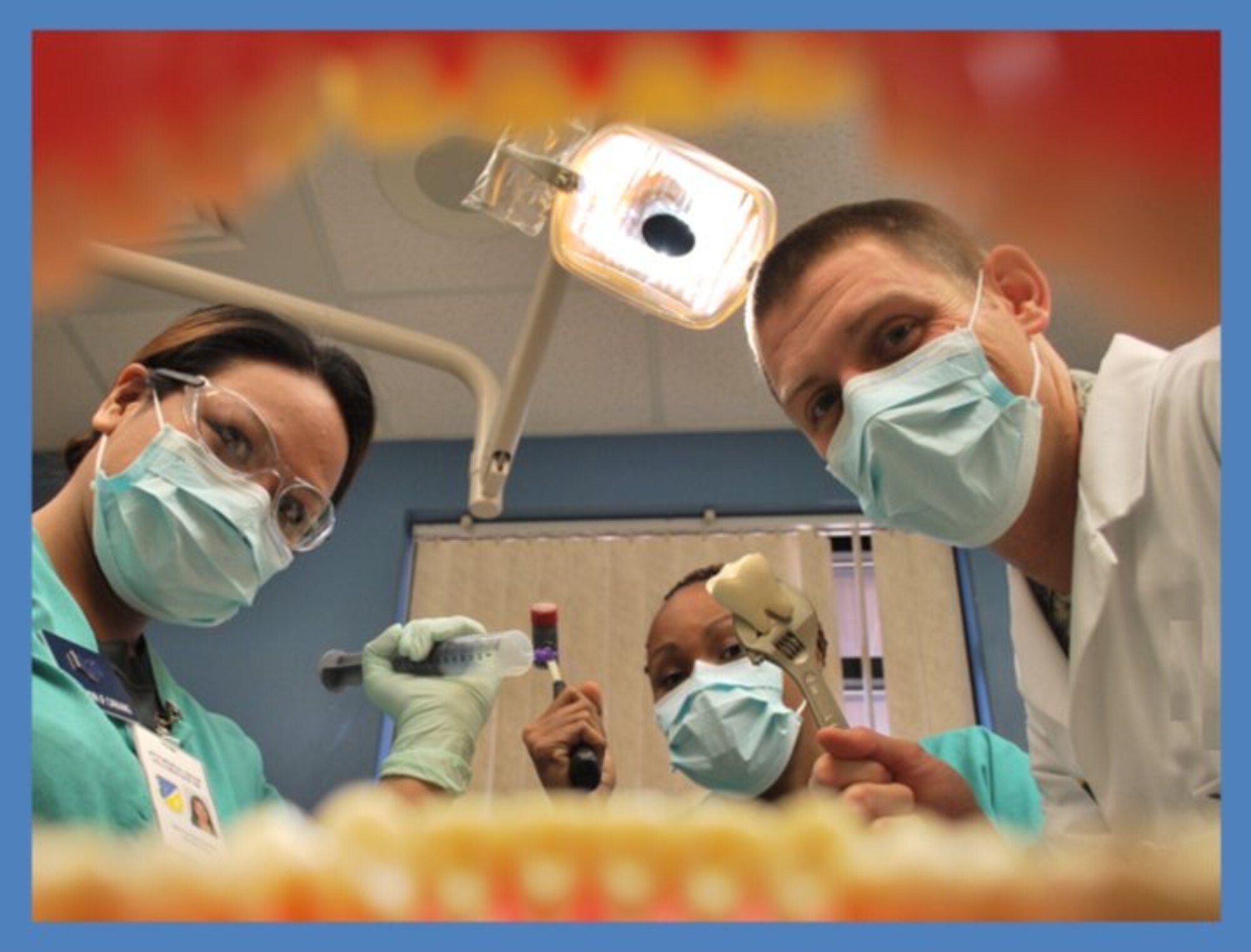 Dentists from the 49th Medical Group look inside a patient's mouth. February, typically known for leap years and Valentine's Day, also marks the time of year when the American Dental Association promotes National Children's Dental Health Month. (Courtesy Photo)
