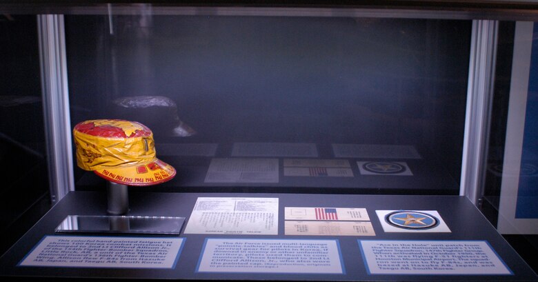 Fatigue hat, blood chit and unit patch worn by Air National Guard members during the Korean War. (U.S. Air Force photo).