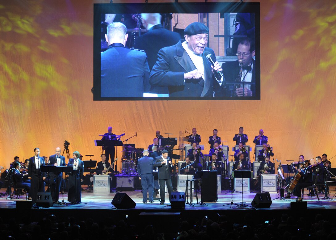 The United States Air Force Band and Al Jarreau perform one of his hit singles “Boogie Down” during the band’s Guest Artist Series at the Daughters of the American Revolution Constitution Hall in Washington, D.C., Feb. 12. The USAF Band had the honor of playing with seven-time Grammy award winner Al Jarreau. The band’s guest artist series began in 1966 and has evolved to feature entertainers of national and international renown. Ensembles have shared the stage with more than 300 prominent artists, including, Wynonna, Al Jarreau, Patti LaBelle, Michael Feinstein, and the Canadian Brass. (U.S. Air Force photo\Staff Sgt. Matt Coleman-Foster)