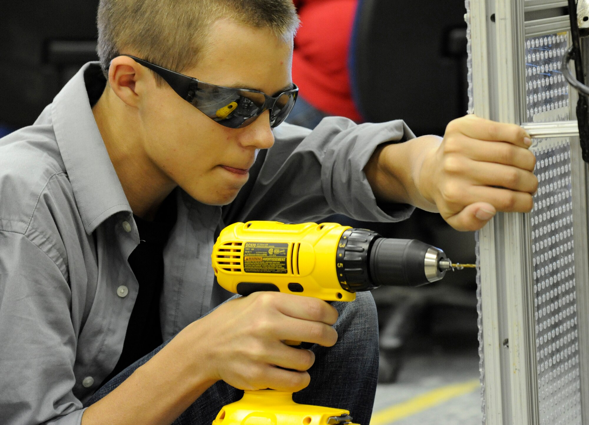 LAUGHLIN AIR FORCE BASE, Texas – A member of the Del Rio High School robotics team drills into the robot’s frame at the school’s engineering shop Feb. 14. For six weeks, the students planned and developed the robot to compete in the Rebound Rumble competition in San Antonio. (U.S. Air Force photo/Airman 1st Class Nathan L. Maysonet)